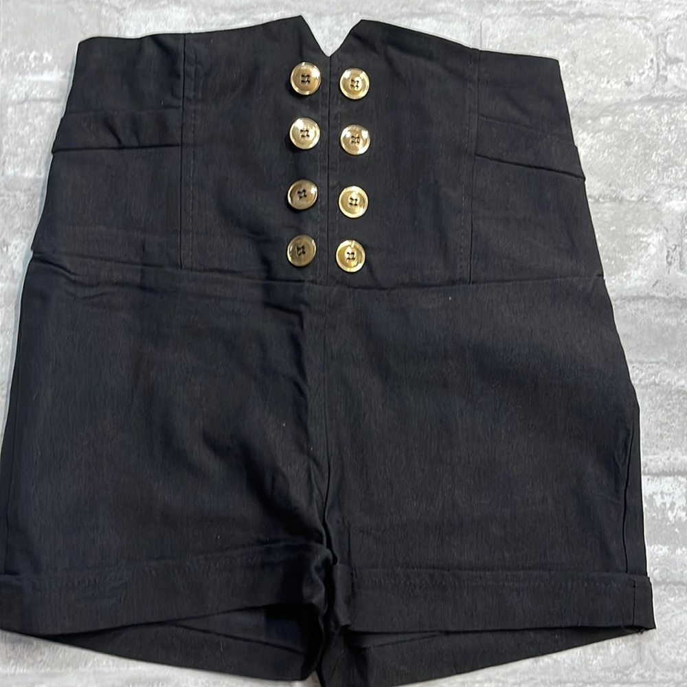 High waisted black shorts.